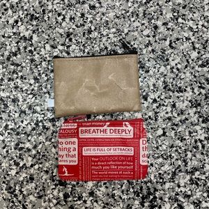 Two lululemon coin pouches